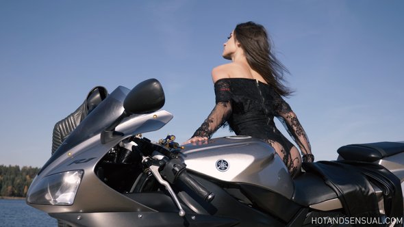 Lady in lace dress gets topless on motorbike showing off her nipples