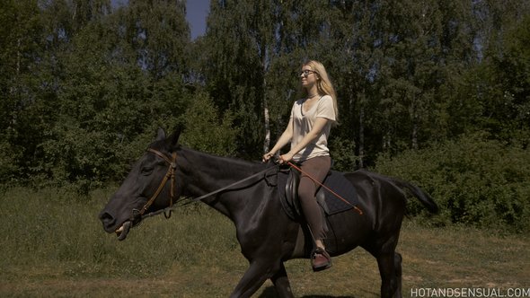 Sexy blonde with small tits bathing after riding a horse