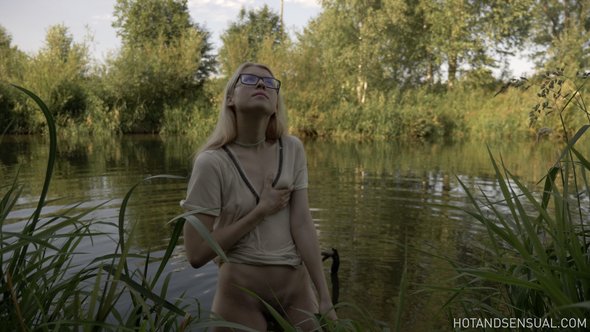 Sexy blonde with small tits bathing after riding a horse