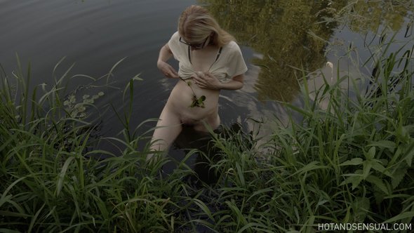 Sexy blonde with small tits bathing after riding a horse